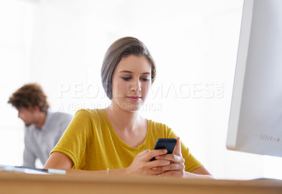 Buy stock photo Business woman, phone and typing at office for social media, communication or networking by computer. Female person or creative employee on mobile smartphone for online chatting, texting or startup