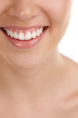Buy stock photo Closeup shot of a young woman's toothy smile against a white background