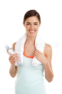 Buy stock photo Shot of a woman holding a bottle of water while wearing a towel around her neck