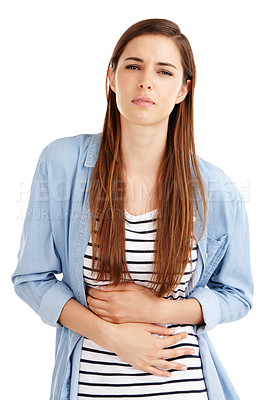 Buy stock photo Studio shot of an attractive young woman suffering from abdominal pain against a white background