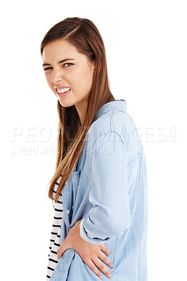 Buy stock photo Studio shot of an attractive young woman suffering from back pain against a white background