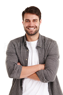 Buy stock photo Studio portrait of a smiling young man standing with his arms folded
