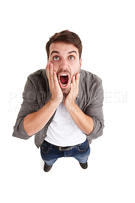 Buy stock photo High-angle shot of a young man in studio screaming in horror