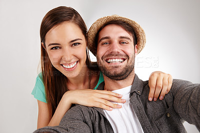 Buy stock photo Self portrait of a happy young couple in studio