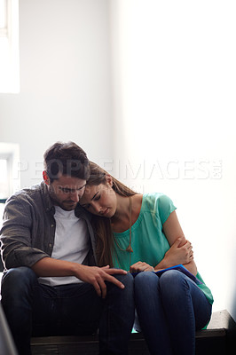 Buy stock photo Shot of a man comforting a distressed woman in a stairwell