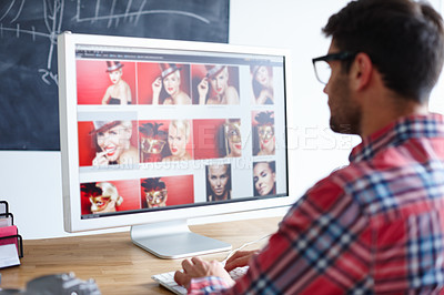 Buy stock photo Shot of a creative professional working at his computer at his desk 
