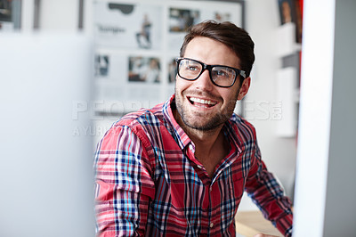 Buy stock photo Shot of a creative professional looking away while smiling positively