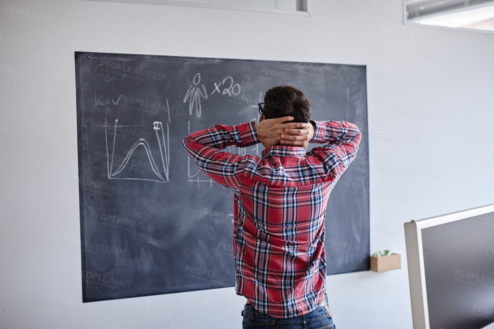 Buy stock photo Rearview shot of a businessman designer graphs on a blackboard