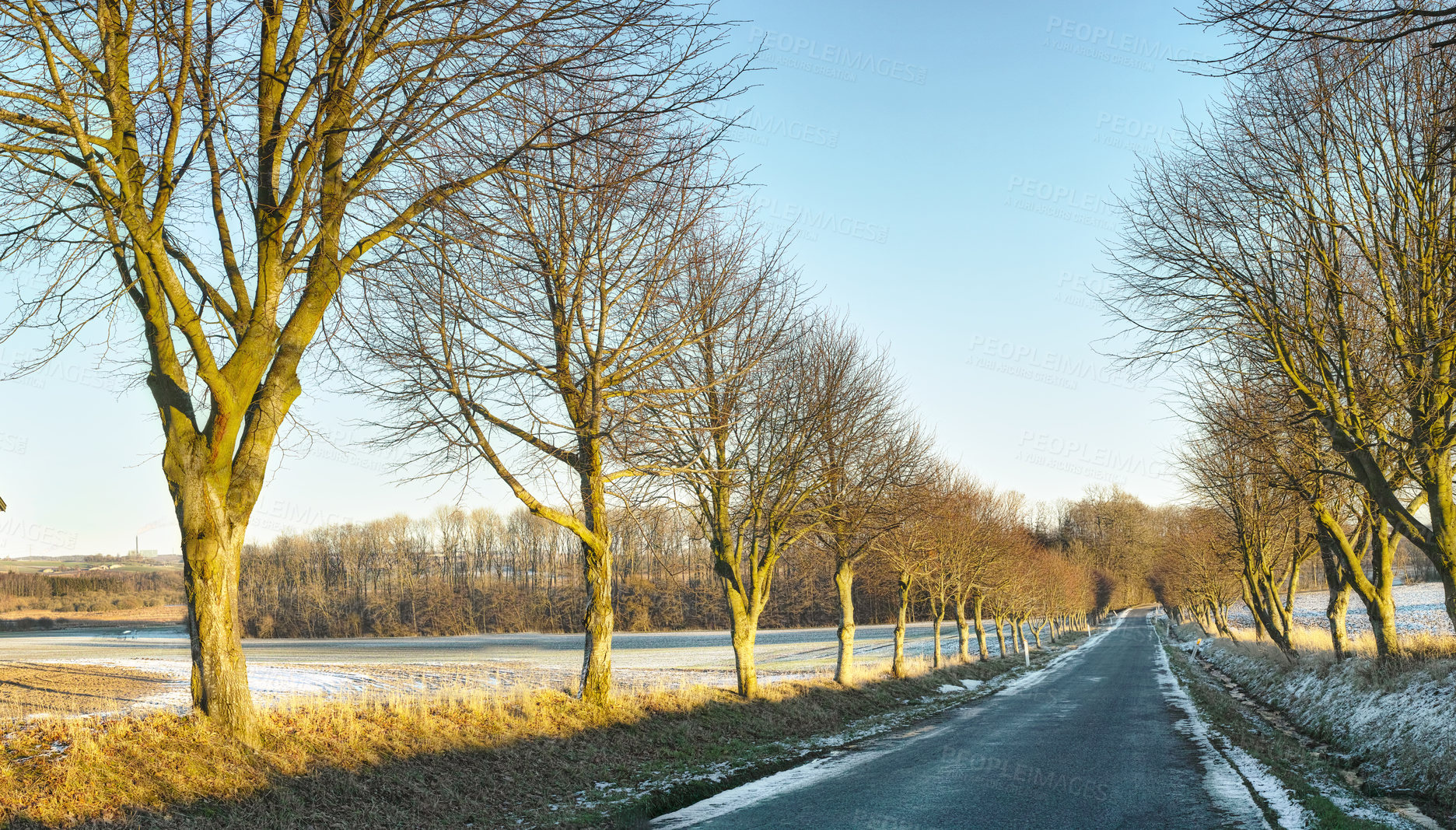 Buy stock photo Winter, countryside and road with snow melting in nature, forest and landscape background. Postcard, wallpaper or calendar art for travel, vacation and holiday season with street, journey and sunrise