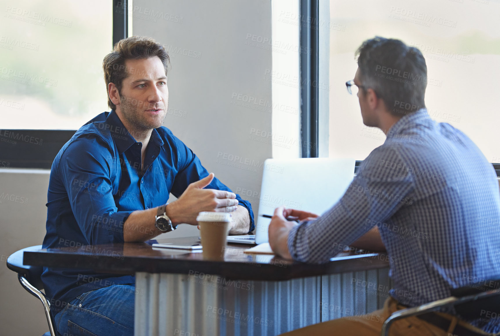 Buy stock photo Meeting, laptop and business people in discussion at coffee shop for planning, conversation and talking. Professional, collaboration and men in restaurant on computer for feedback, review or teamwork
