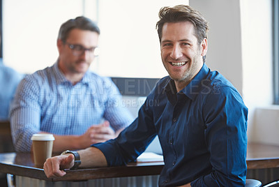 Buy stock photo Portrait of a two colleagues having a talk over coffee in an office