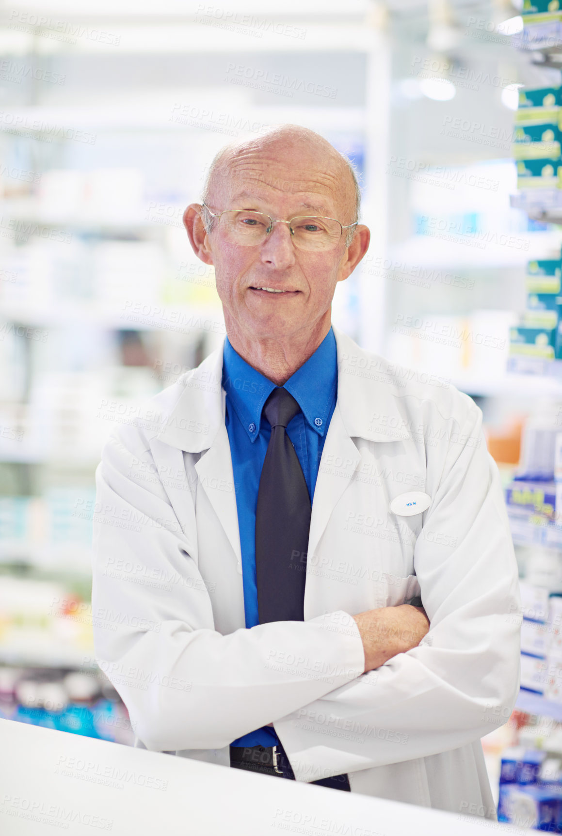 Buy stock photo Mature man, pharmacist or confident in portrait for knowledge, expert or healthcare in pharmacy. Chemist, smile or arms crossed in drugstore with pride, career or happy for job in retail dispensary