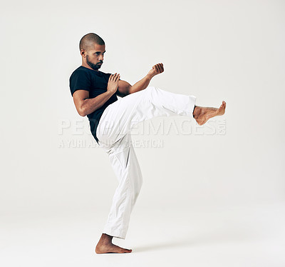 Buy stock photo Man, studio and martial arts for training practice, action and karate exercise on white background. Black male person, mockup space and strong for combat, fight and position of attack in kung fu