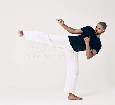 Buy stock photo Martial arts, karate and man with training, fitness and wellness on a white studio background. Healthy person, fighter and model with practice and self defense with sports and striking with workout