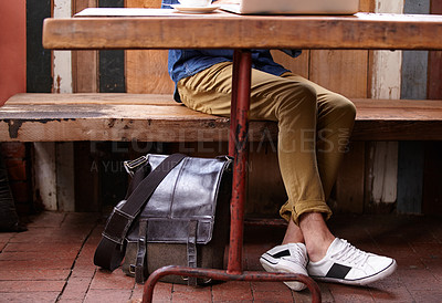 Buy stock photo Backpack, cafe store or legs of person, student or freelancer working on research project, university report or study. Bag, remote work or relax customer, client or college blogger in restaurant shop