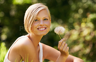Buy stock photo Shot of an attractive young woman outdoors on a summer day