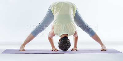 Buy stock photo Full length shot of a woman stretching before yoga