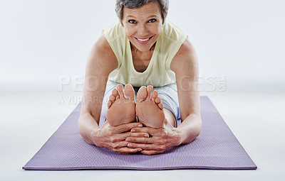 Buy stock photo Full length portrait of an attractive woman stretching before yoga