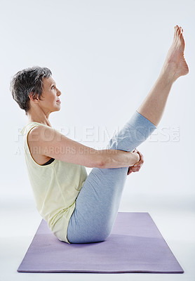 Buy stock photo Full length shot of an attractive woman stretching before yoga