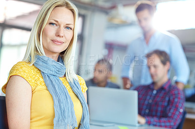 Buy stock photo Portrait of a young designer with colleagues in the background