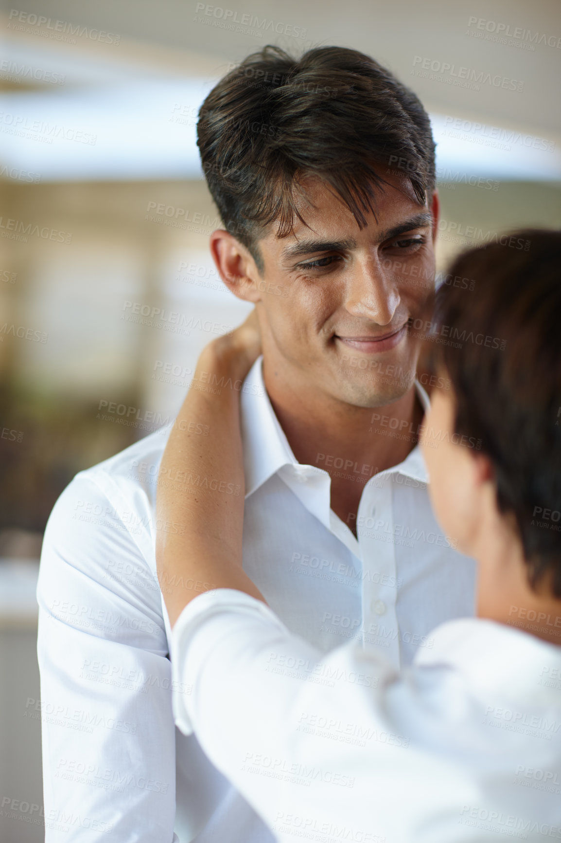 Buy stock photo Shot of a couple embracing each other indoors