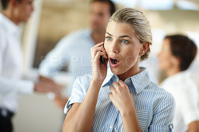 Buy stock photo Shot of a young businesswoman looking shocked while on the phone at the office