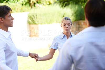 Buy stock photo Shot of a group of colleagues meditating while on a business retreat