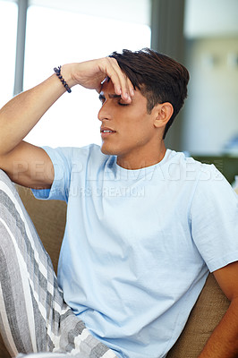 Buy stock photo Shot of a young man looking depressed