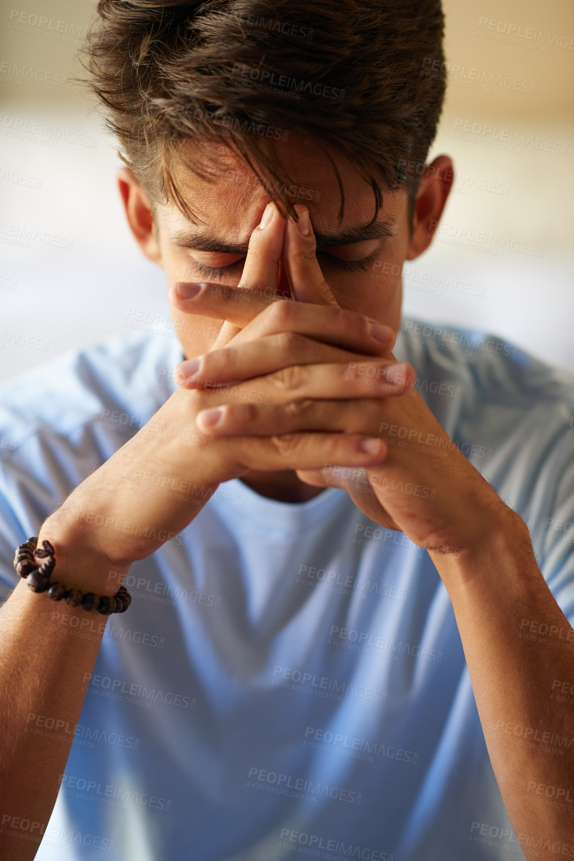 Buy stock photo Shot of a young man looking depressed