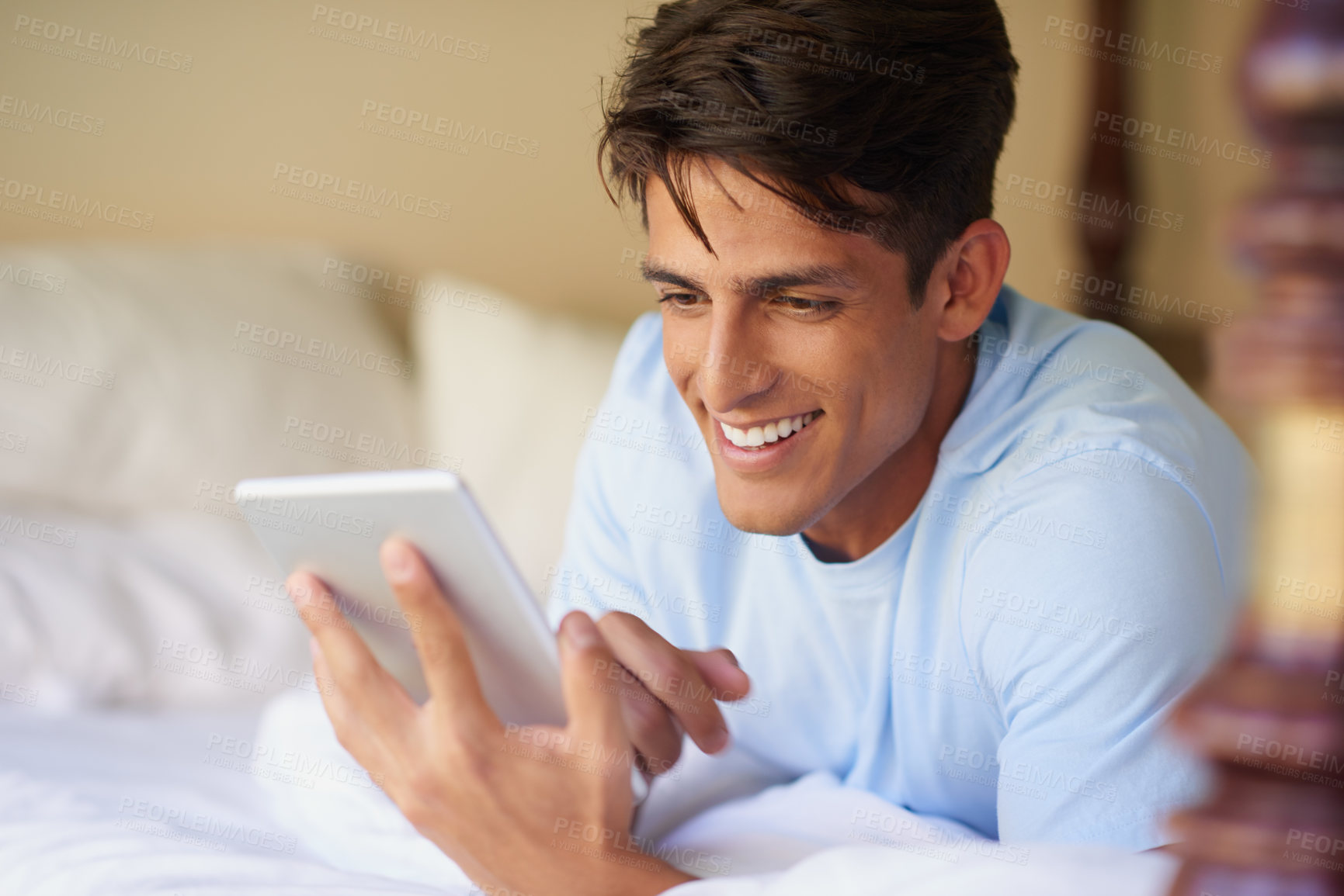 Buy stock photo Bedroom, smile and man with tablet, relax and internet for social media, scrolling and comfort. House, person and guy with technology, connection and network for texting, message and online reading