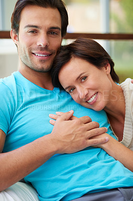 Buy stock photo Portrait of a husband and wife holding hands while relaxing at home