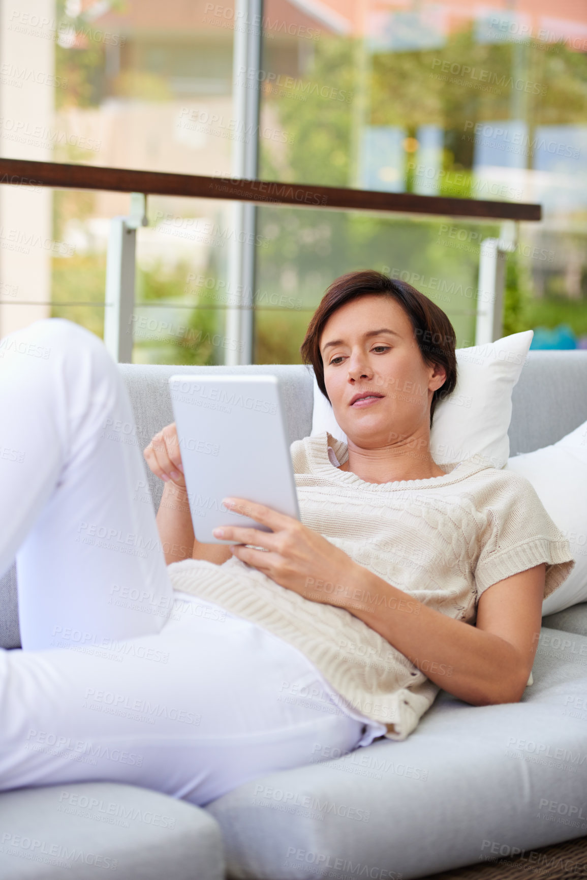 Buy stock photo Sofa, relax and woman with tablet for scroll, online communication and web subscription at home. House, female person and browse with digital for interactive app, social media and game in lounge