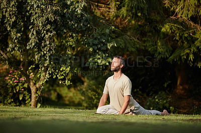 Buy stock photo Full length shot of a handsome mature man doing yoga in the outdoors