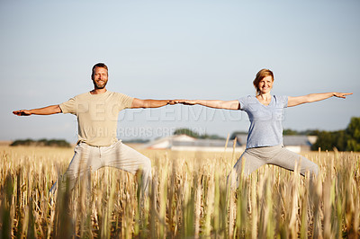 Buy stock photo Portrait of a mature couple enjoying a yoga workout in a crop field