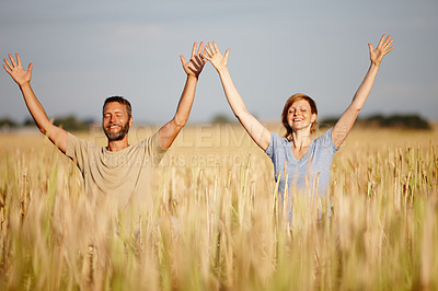 Buy stock photo Shot of a happy mature couple enjoying a yoga workout in a crop field