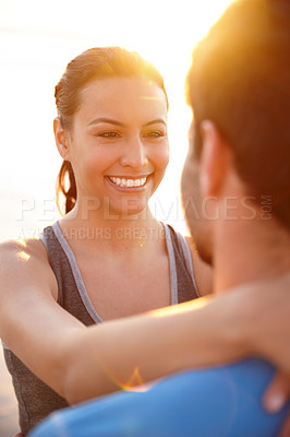Buy stock photo Shot of a young woman looking happily into her boyfriend's face