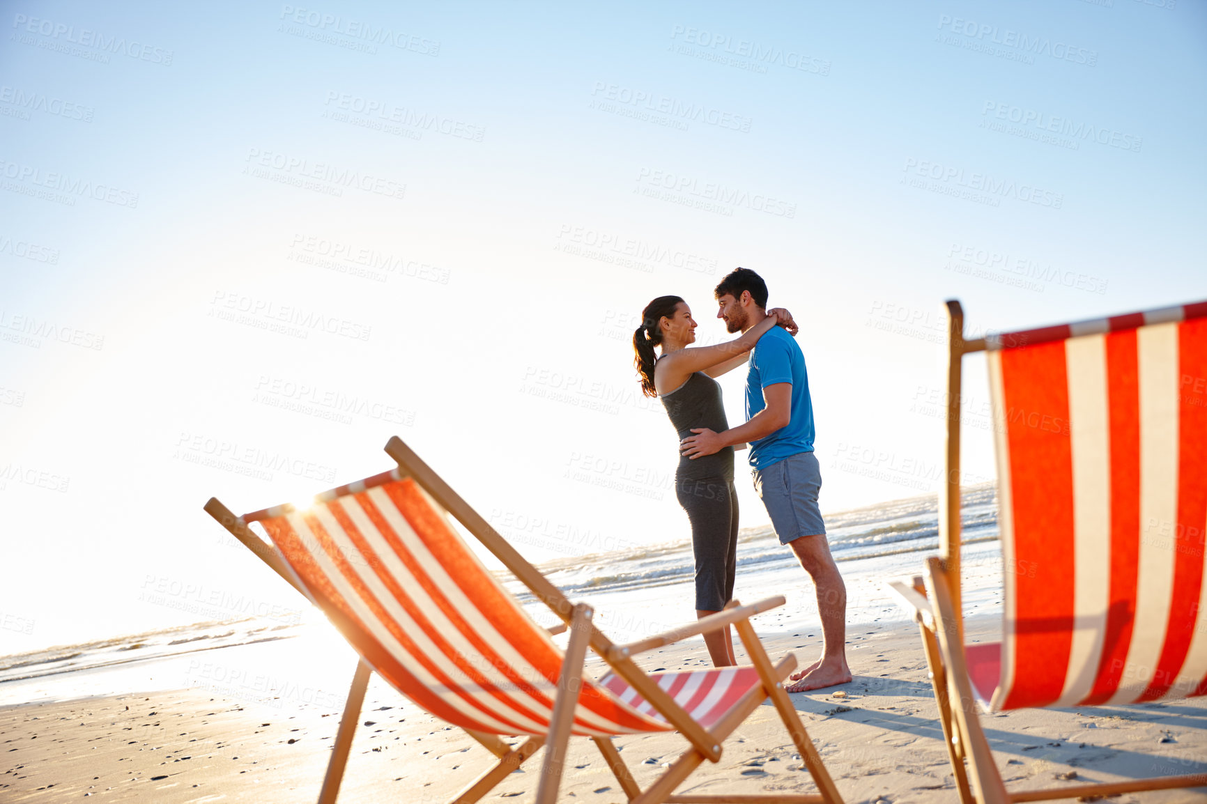 Buy stock photo Scenery, hug and couple on vacation, beach and romance for affection on trip for date, travel and sky. Ocean, embrace and people on holiday for peace, love and view of sea, outdoor or mockup space
