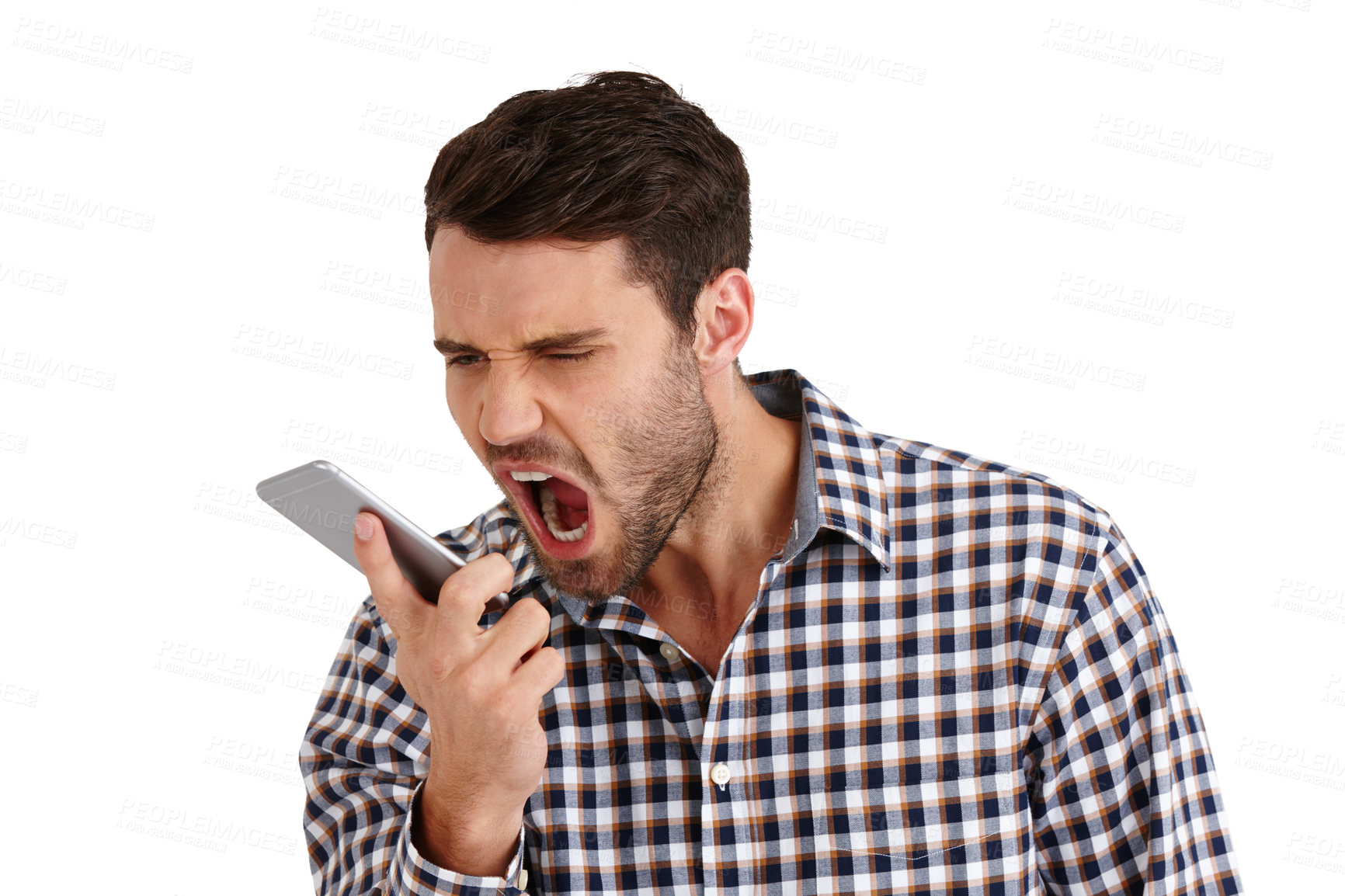 Buy stock photo Studio shot of a young man shouting into his cellphone isolated on white