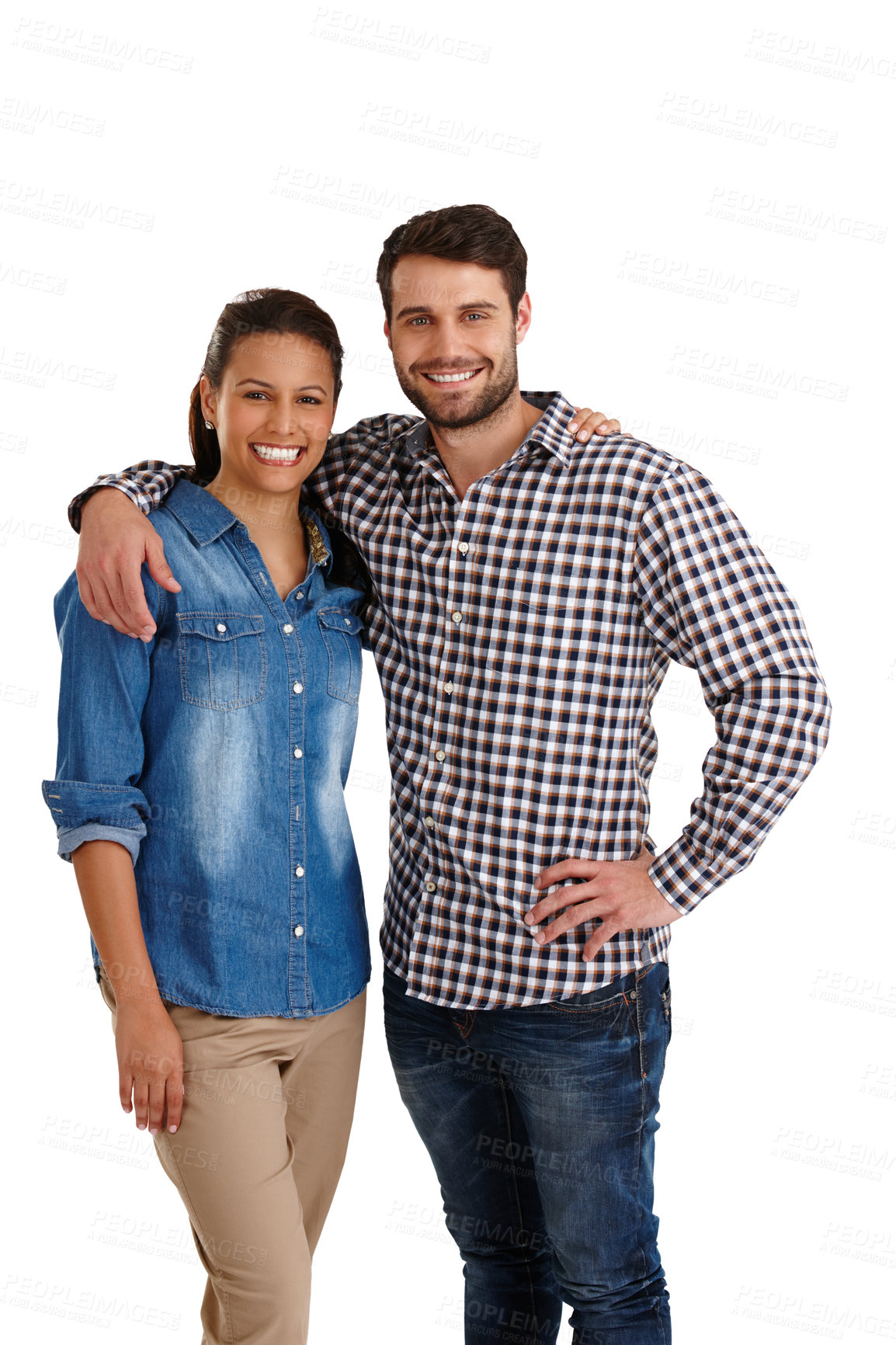 Buy stock photo Studio portrait of an affectionate young couple standing with their arms around each other isolated on white