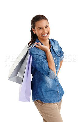Buy stock photo Studio portrait of an attractive young woman carrying shopping bags isolated on white