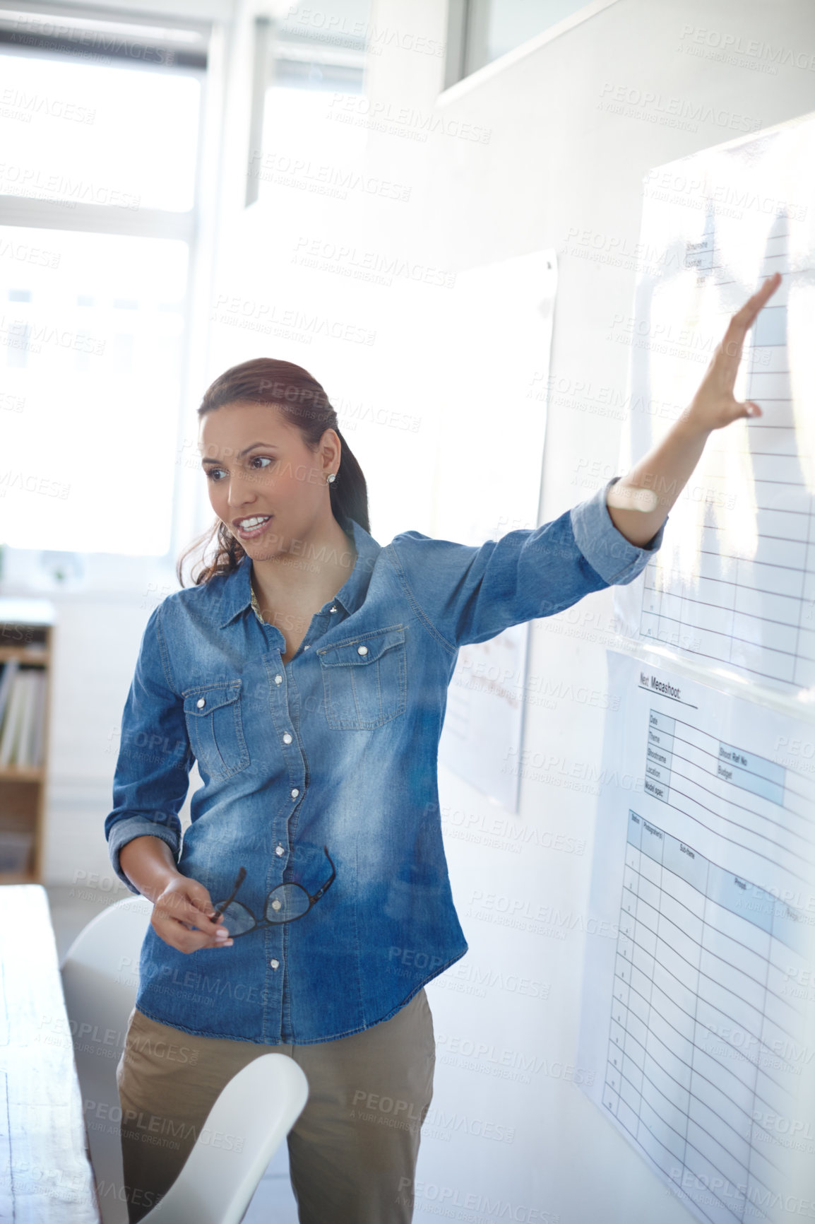 Buy stock photo Cropped shot of an attractive young woman giving a presentation