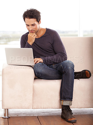 Buy stock photo Man, work from home and thinking on computer for stock market investment, reading information or website on sofa. Freelancer or trader on his laptop with trading software, choice or online decision