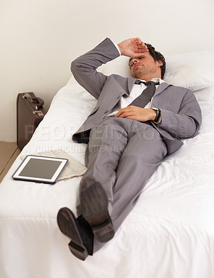 Buy stock photo Burnout, depression and tired business man in bed with mental health crisis, mistake or stress at home. Anxiety, fatigue or workaholic in bedroom with headache, vertigo or digital alarm clock fail