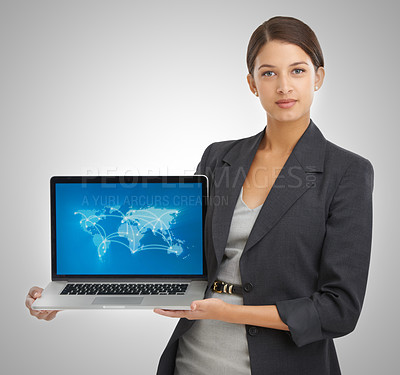 Buy stock photo Studio portrait of a businesswoman holding a laptop showing a world map with locations on it