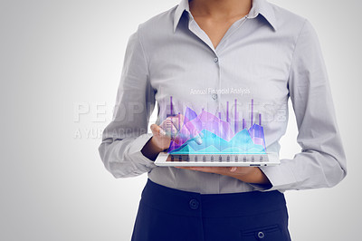 Buy stock photo Cropped shot of a businesswoman using a digital tablet to analyze financial data