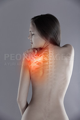 Buy stock photo Woman, shoulder pain or back injury in studio while frustrated, burnout or experience health problem. Female person massage red anatomy glow, spine accident or scoliosis backache on a grey background