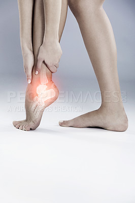 Buy stock photo Ankle, pain and emergency injury in foot with inflammation from arthritis or osteoporosis in studio. Medical, trauma and xray glow on legs of person with tendinitis in feet, gout in joint or crisis