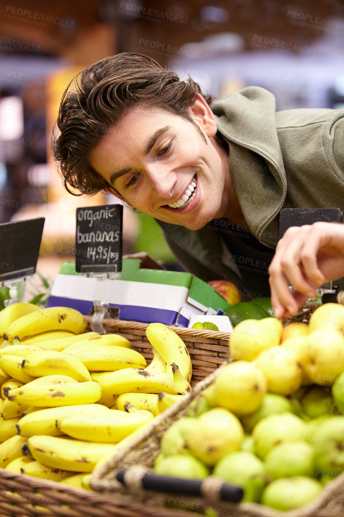 Buy stock photo Man, fruit and supermarket choice for health diet, nutrition or shopping product sale. Male person, happy customer or pear stock in grocery store for organic vegan offer, quality price or fibre food
