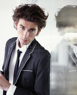 Buy stock photo Fashion, formal and portrait of man in a studio with blazer, classy and elegant outfit for confidence. Handsome, suit and young male model with trendy and cool style with reflection in glass