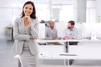 Buy stock photo Shot of a young businesswoman standing in an office